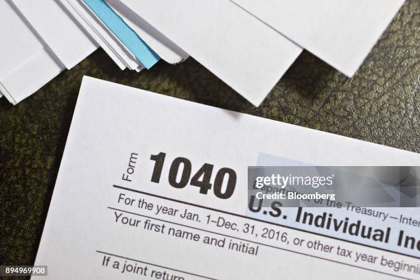 Department of the Treasury Internal Revenue Service 1040 Individual Income Tax forms for the 2016 tax year are arranged for a photograph in Tiskilwa,...