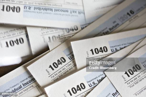 Department of the Treasury Internal Revenue Service 1040 Individual Income Tax forms for the 2016 tax year are arranged for a photograph in Tiskilwa,...