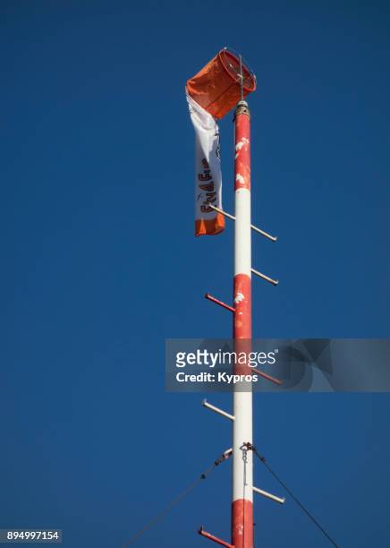 europe, austria, salzburg area, october 2017: view of wind sock (or windsock) to determine wind direction )on top of mountain) - zephyros stockfoto's en -beelden