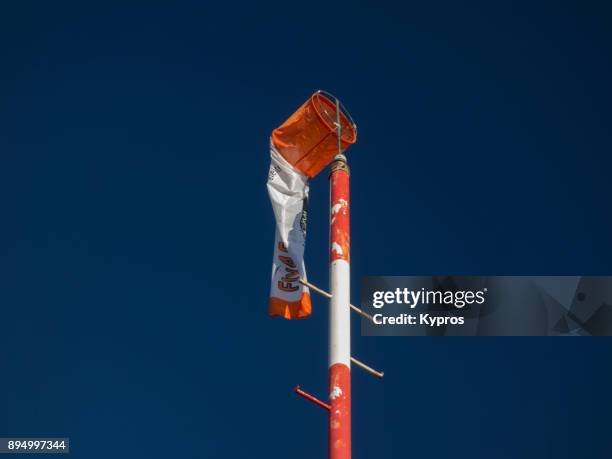 europe, austria, salzburg area, october 2017: view of wind sock (or windsock) to determine wind direction )on top of mountain) - zephyros stockfoto's en -beelden