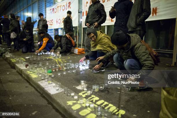 Residents of the area of La Villette, northern Paris, hold rally on December 18, 2017 in front of the enter of the refugee reception platform of...