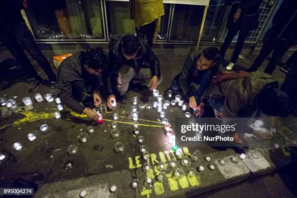 Residents of the area of La Villette, northern Paris, hold rally on December 18, 2017 in front of the enter of the refugee reception platform of...