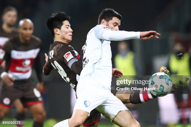 Yiyoung Park of Pauli and Tim Hoogland of Bochum compete for the ball during the Second Bundesliga match between FC St. Pauli and VfL Bochum 1848 at...