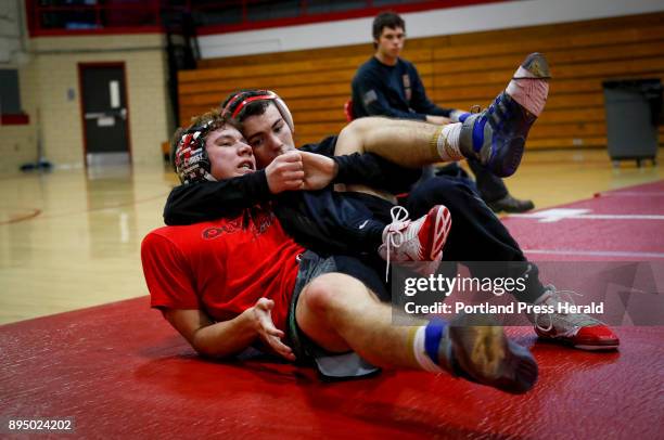Sanford High School wrestlers Isaac Plante, a Class A state runner-up, left, and Sam Anderson, a defending state champ, right, wrestle Thursday, Dec....
