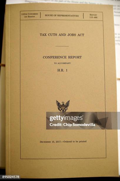 Copy of the Tax Cuts and Jobs Act Conference Report sits on the dais of the House Rules Committee at the U.S. Capitol December 18, 2017 in...