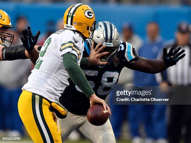 Carolina Panthers outside linebacker Thomas Davis pressures Green Bay Packers quarterback Aaron Rodgers during the second half on Sunday, Dec. 17,...