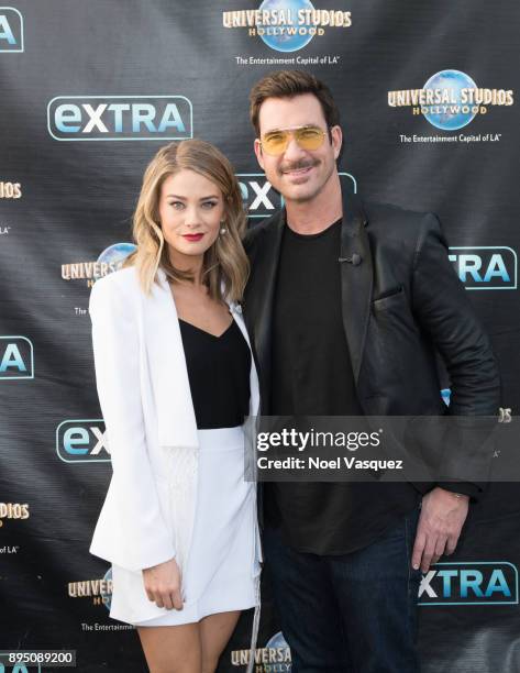 Dylan McDermott and Kim Matula visit "Extra" at Universal Studios Hollywood on December 18, 2017 in Universal City, California.