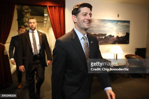Speaker of the House Paul Ryan smiles as he leaves a House Republican Conference meeting in the basement of the U.S. Capitol December 18, 2017 in...