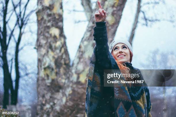 redhead woman in winter public park - 1987 25-35 stock pictures, royalty-free photos & images