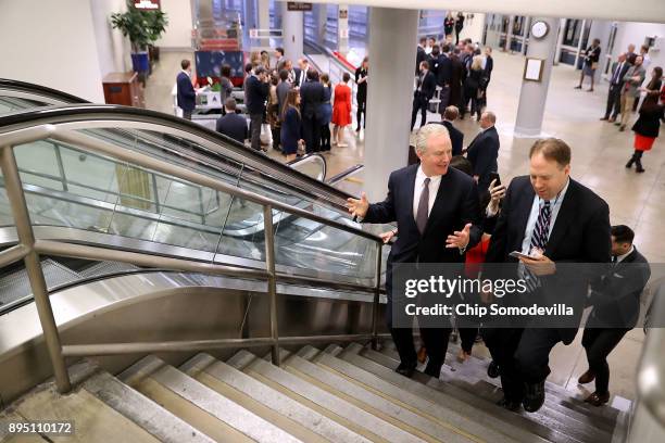 Sen. Chris Van Hollen talks with reporters as he walks to a vote in the basement of the U.S. Capitol December 18, 2017 in Washington, DC. The House...