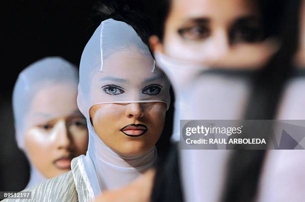 Models present creations by Colombian designer Diana Cadavid during the Colombiamoda fashion show on July 29 in Medellin, Antioquia department,...