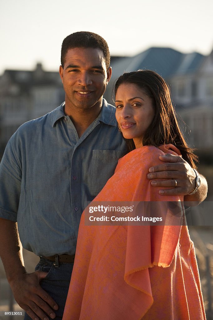 Couple in front of house