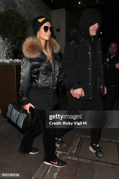 Paris Hilton and boyfriend Chris Zylka seen leaving Mayfair hotel on December 18, 2017 in London, England.