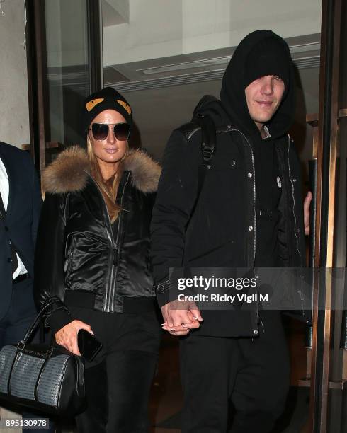 Paris Hilton and boyfriend Chris Zylka seen leaving Mayfair hotel on December 18, 2017 in London, England.