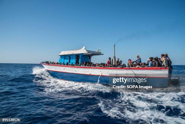 Migrants in a boat that left Libya few hours before being rescued by the Spanish NGO Proactiva Open Arms. The Spanish NGO Proactiva Open Arms rescued...