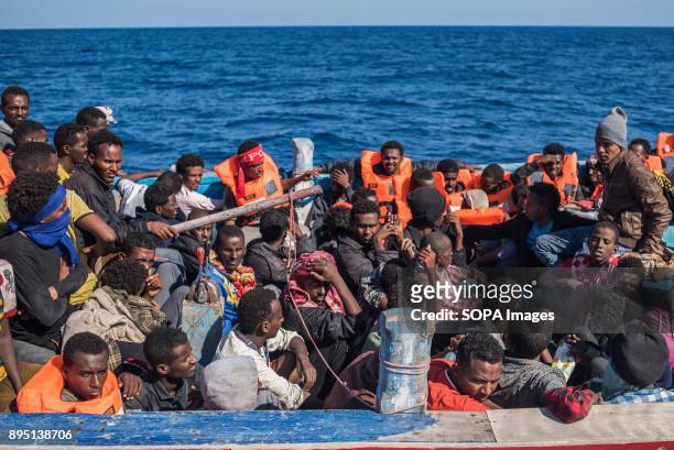 Migrants seen packed in their boat crossing the ocean into Europe. They were coming from Libya and rescued by the Spanish NGO Proactiva Open Arms....