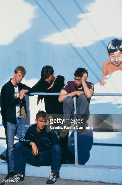 English rock band Blur pose in front of a mural, 18th October 1994. From left to right, drummer Dave Rowntree, bassist Alex James and guitarist...