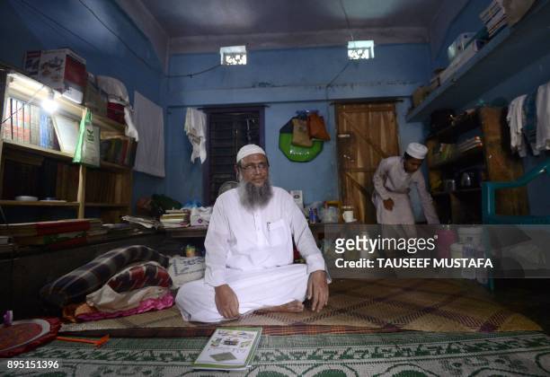 In this photograph taken on October 20 Myanmar Rohingya Islamic scholar Muhammed Hanif speaks during an interivew with AFP at a madrassa in the...