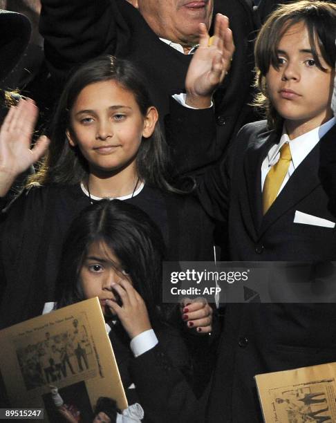 Michael Jackson's daughter Paris Michael Katherine Jackson and two sons Prince Michael Jackson II and Prince Michael Jackson I wave at the end of a...