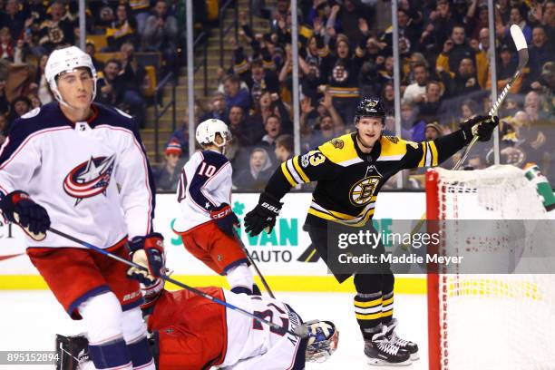 Danton Heinen of the Boston Bruins celebrates after scoring against the Columbus Blue Jackets during the third period at TD Garden on December 18,...