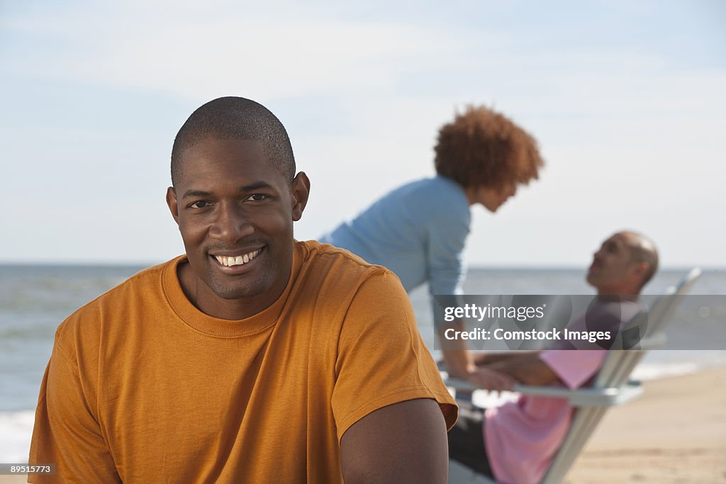 Man looking at veiwer with couple