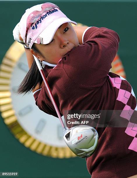 Yuko Mitsuka of Japan plays her tee shot on the sixteenth hole during the first round of the Ricoh Women's British Open golf championship at Royal...