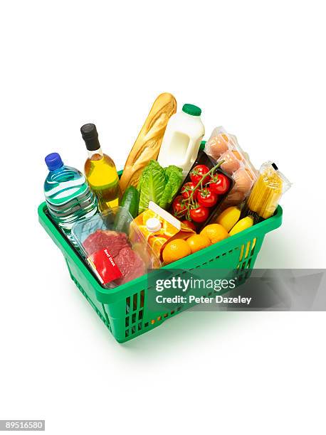 supermarket basket with organic produce on white. - boodschappenmand stockfoto's en -beelden