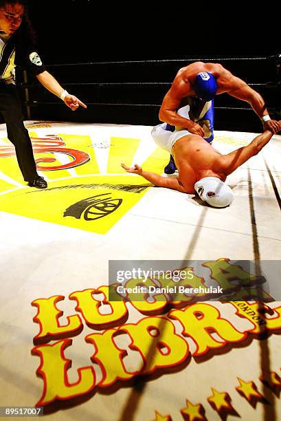 Mexican Lucha Libre Wrestler El Hijo Del Santo competes against Blue Demon Jr. At the Roundhouse in Camden on July 5, 2008 in London, England.