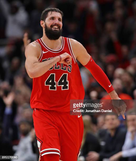 Nikola Mirotic of the Chicago Bulls celebrates as he runs down the court after hitting a 3 point shot late in the game against the Philadelphia 76ers...