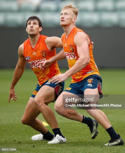 Sam Mayes and Nick Robertson of the Lions in action during the Brisbane Lions AFL pre-season training session at University of Tasmania Stadium on...