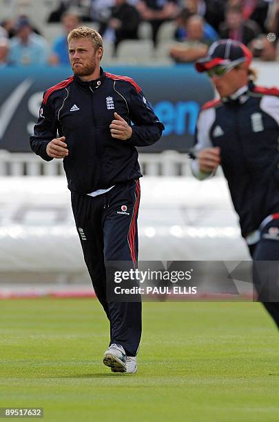 England cricketer Andrew Flintoff warms up with his team mates as rain delays play on the first day of the third Ashes cricket test between England...