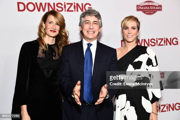 Laura Dern, Alexander Payne and Kristen Wiig attend the premiere of Paramount Pictures' "Downsizing" at Regency Village Theatre on December 18, 2017...