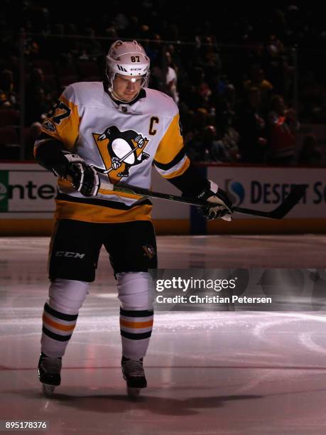 Sidney Crosby of the Pittsburgh Penguins skates on the ice before the NHL game against the Arizona Coyotes at Gila River Arena on December 16, 2017...