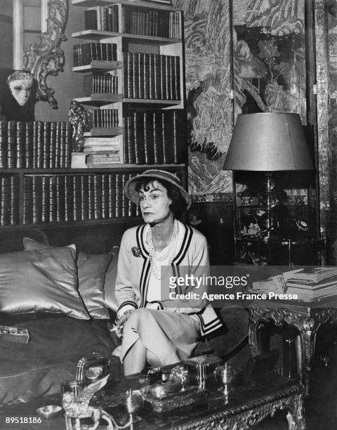 French fashion designer Coco Chanel in her apartment at the Hotel Ritz Paris, 1960.