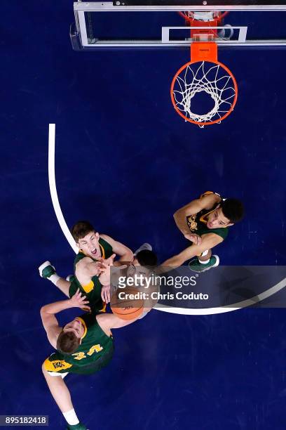 Dusan Ristic of the Arizona Wildcats fights for a rebound with Rocky Kreuser, Chris Quayle and Cameron Hunter of the North Dakota State Bison during...
