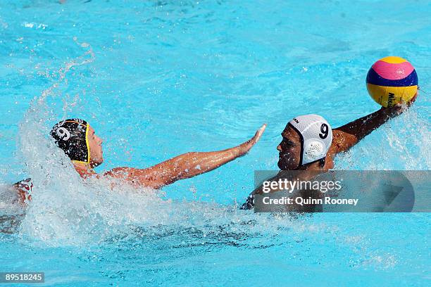 Aaron Feltham of Canada throws the ball as he is closed down by Tobias Preuss of Germany in the Men's Water Polo semifinal match between Canada and...