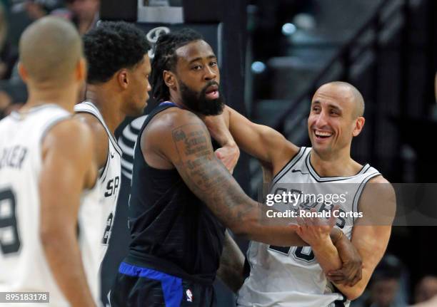 Manu Ginobili of the San Antonio Spurs jokes with DeAndre Jordan of the Los Angeles Clippers at AT&T Center on December 18, 2017 in San Antonio,...