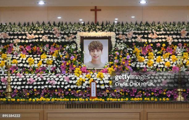 The portrait of Kim Jong-Hyun, a 27-year-old lead singer of the massively popular K-pop boyband SHINee, is seen on a mourning altar at a hospital in...