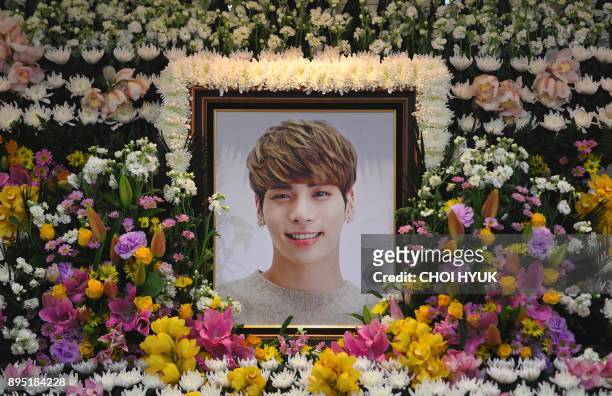 The portrait of Kim Jong-Hyun, a 27-year-old lead singer of the massively popular K-pop boyband SHINee, is seen on a mourning altar at a hospital in...
