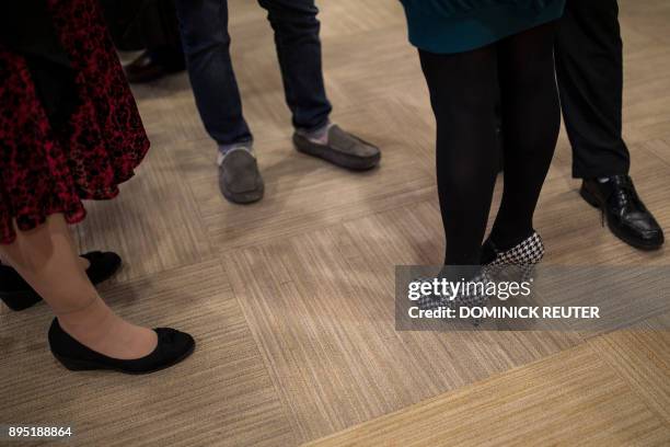 Advertising Specialty Institute employees socialize during a company holiday party on December 14, 2017 in Trevose, Pennsylvania. The Christmas party...