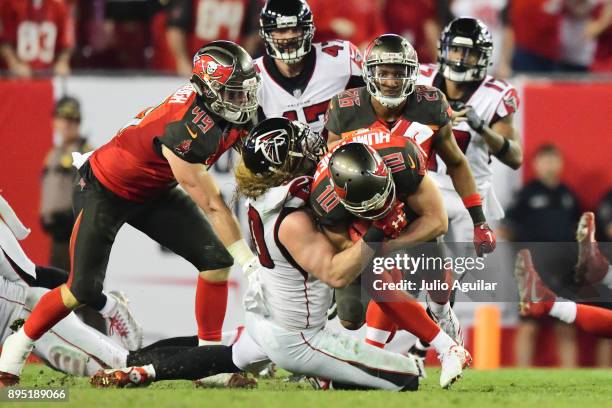 Defensive end Brooks Reed of the Atlanta Falcons tackles wide receiver Adam Humphries of the Tampa Bay Buccaneers late in the fourth quarter on...