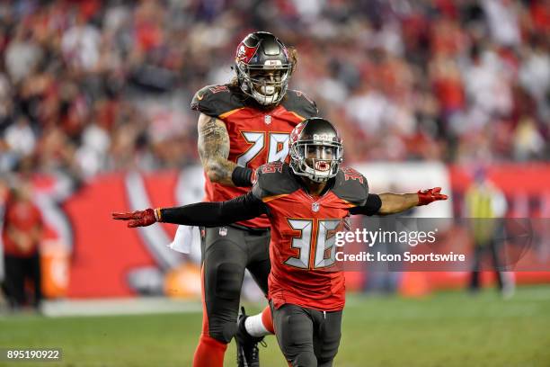 Tampa Bay Buccaneers cornerback Robert McClain and Tampa Bay Buccaneers defensive end Patrick O'Connor celebrate a blocked field goal attempt during...