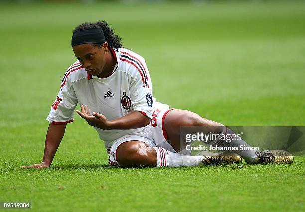 Ronaldinho of Milan sits on the pitch during the Audi Cup tournament final match for the third place Boca Juniors v AC Milan at Allianz Arena on July...
