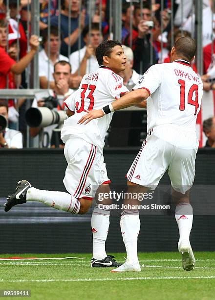 Thiago Silva of Milan celebrates with teammate Oguchi Onyewu after scoring 1-0 during the Audi Cup tournament final match for the third place Boca...