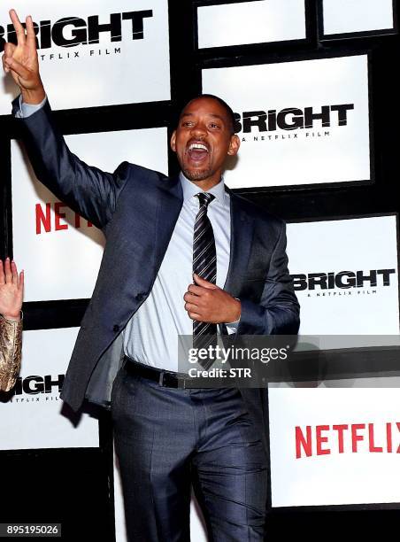 American Hollywood actor and producer Will Smith gestures as he attends the premier of his cop thriller movie 'Bright' in Mumbai on December 18,...
