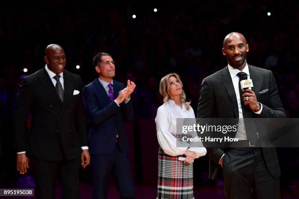 Kobe Bryant addresses the crowd at halftime as both his and Los Angeles Lakers jerseys are retired at Staples Center on December 18, 2017 in Los...
