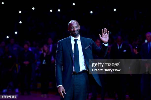 Kobe Bryant smiles at halftime as both his and Los Angeles Lakers jerseys are retired at Staples Center on December 18, 2017 in Los Angeles,...