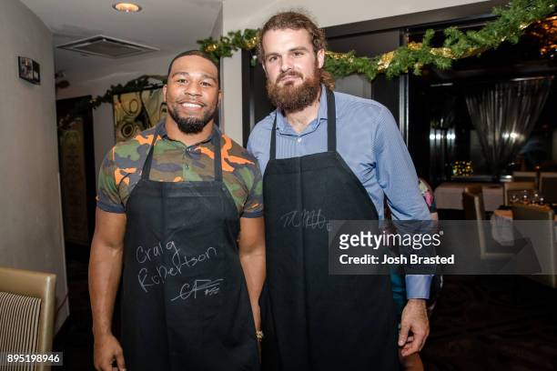 New Orleans Saints linebacker Craig Robertson and punter Thomas Morstead attend the Cam Jordan Celebrity Server Event at Morton's Steakhouse on...