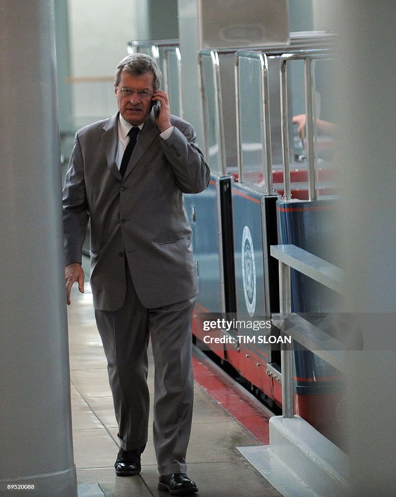 Baucus US Senator Max Baucus talks on his cell phone at the Senate subway ...