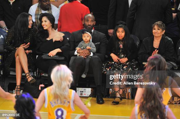 Kobe Bryant, wife Vanessa Bryant and daughters Gianna Maria Onore Bryant, Natalia Diamante Bryant and Bianka Bella Bryant attend a basketball game...